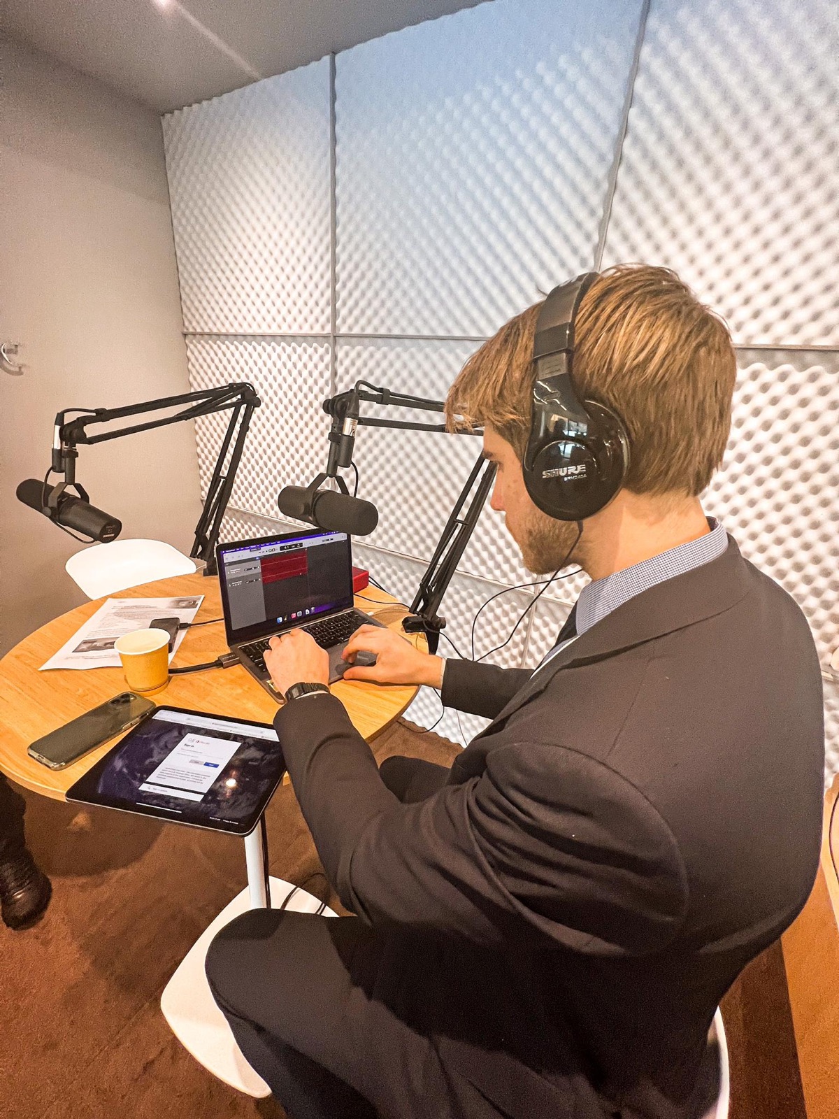 Recording a podcast session in a treated booth