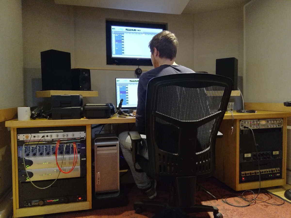 Samuel Pickens at a studio control room desk